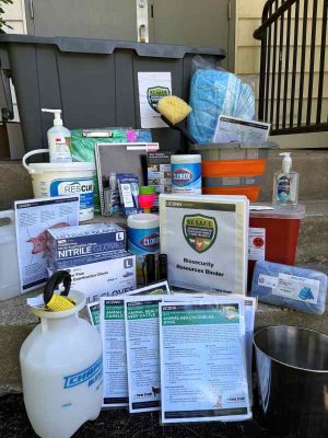 Supplies come in a durable, water-proof storage box with handles. Inside the box you can find materials to aid fair associations in keeping their events safe and healthy. Supplies include: Hand sanitizer, Rescue wipes, disinfecting wipes, latex gloves, thermometer, scrub brush, boot covers, sharps container, bleach container, metal bucket, flashlights, tape, clip boards, wash bucket, notebooks, animal health checklists, brochure.